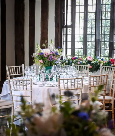 table set up for dinner with flower centre pieces. Gregg Brown photography