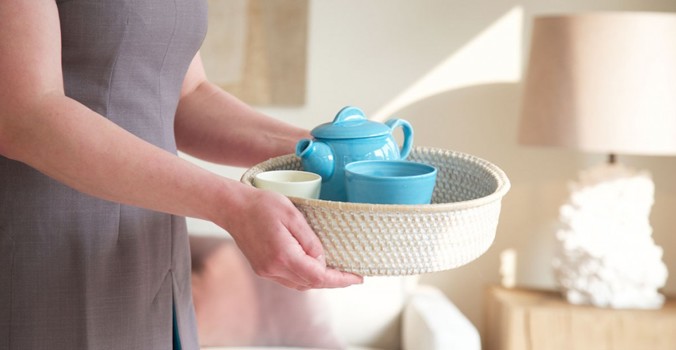 Weavers' House Spa, therapist holding herbal tea selection in a basket