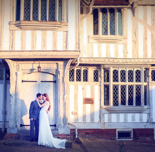 Swan at Lavenham Hotel & Spa - Weddings - couple outside medieval crooked buildings