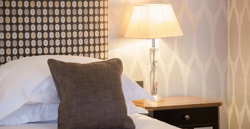The Swan at Lavenham bed and side table close up