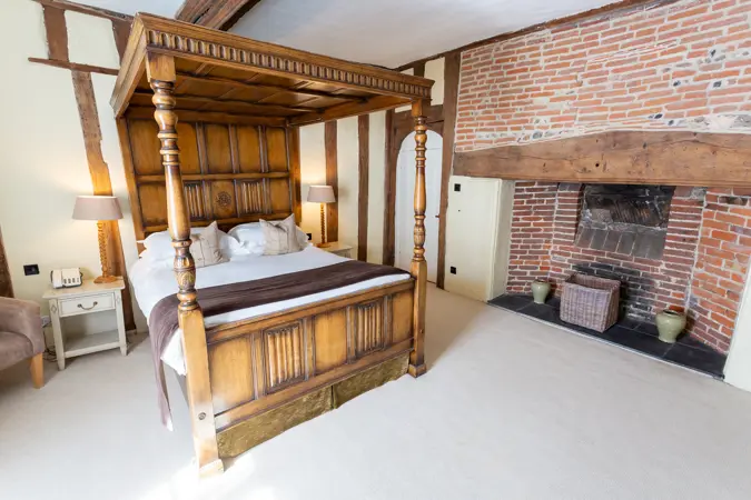 four poster room 55 showing fireplace