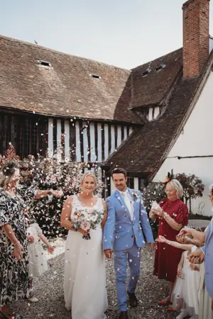 throwing confetti over bride and groom