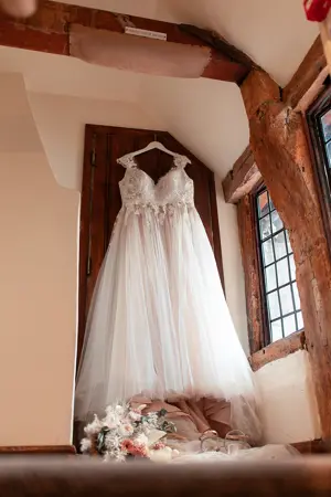 Wedding dress hanging in bedroom - Steve Harrowing Photography