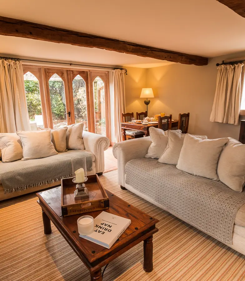 The Priory Dairy, Lavenham, self-catering, lounge area with sofas, coffee table and furnishings