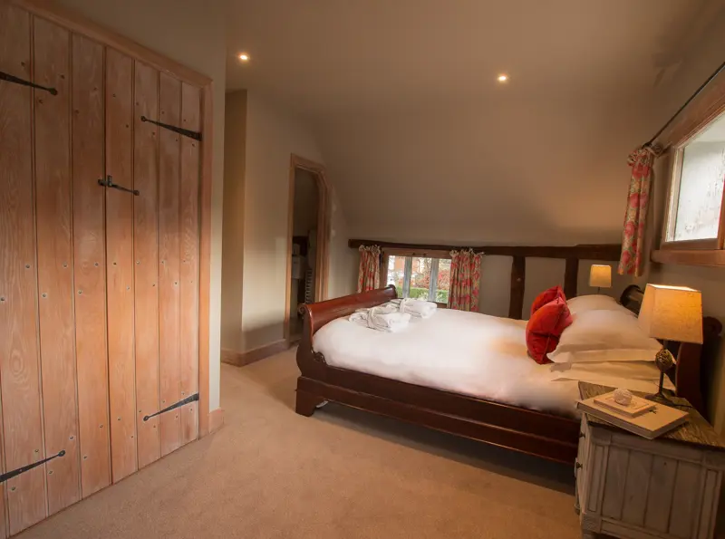 The Priory Dairy, Lavenham, self-catering, Master bedroom with bed and built in wardrobes