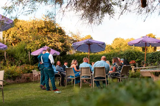 guests gathered in the garden - Steve Harrowing Photography
