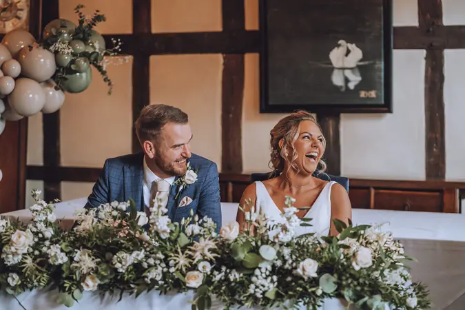 Bride and Groom smiling and laughing - Lottie Photography