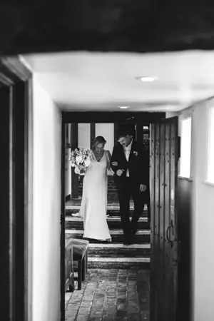 Gregg Brown photography - bride walking along corridor