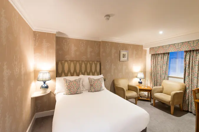 Edwardstone room showing bed and seating area