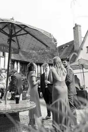 guests celebrating in the courtyard - Steve Harrowing Photography