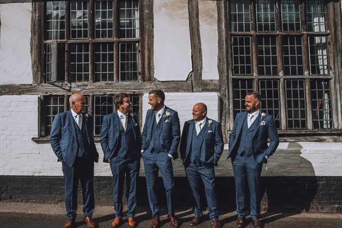 Grooms party joking and laughing - Lottie Photography