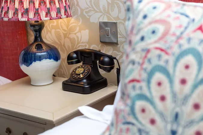 Bedroom details, phone and lamp